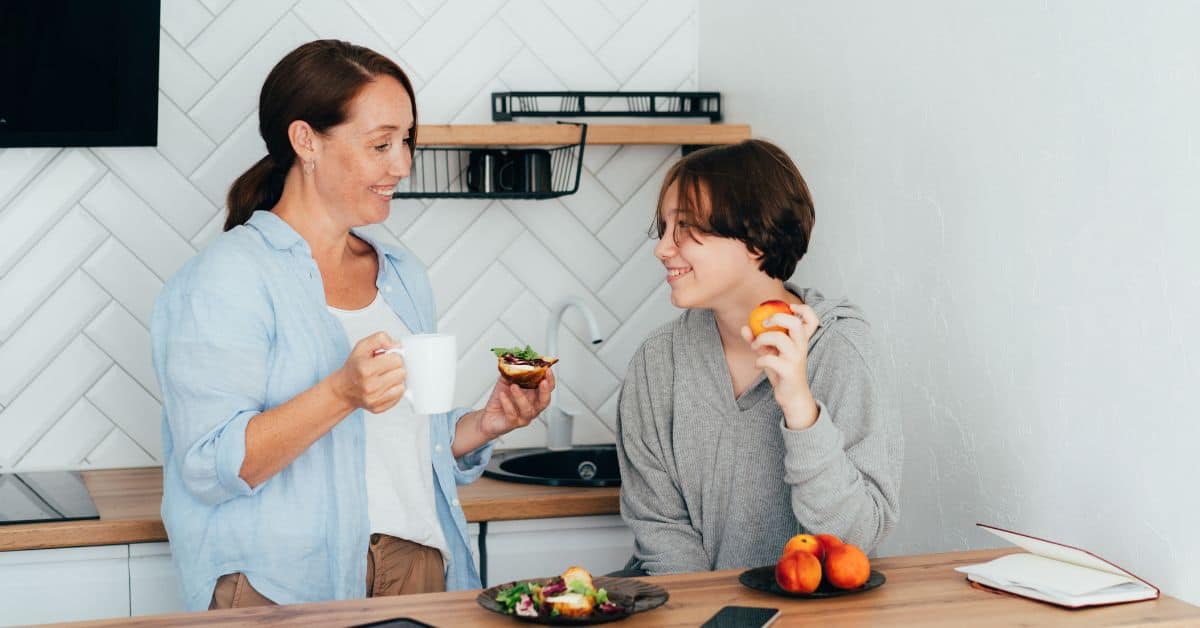 Mom and teenager discussing in the kitchen